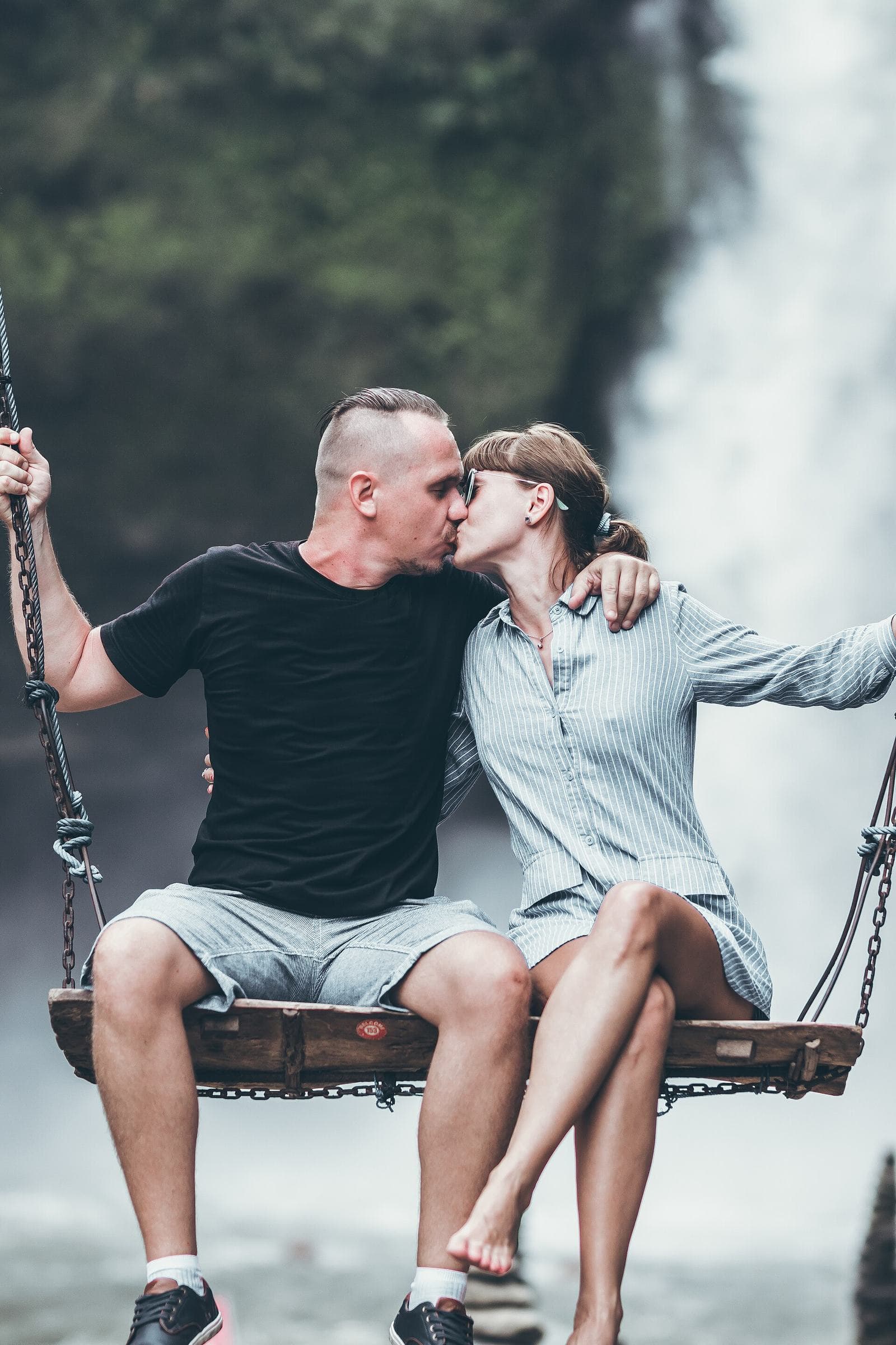 Jungle swing above a waterfall in forest near Ubud